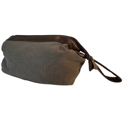 Bellemonde Washed Grey Canvas Dopp Kit shown from the side with an engraved zipper pull and brown loop handle