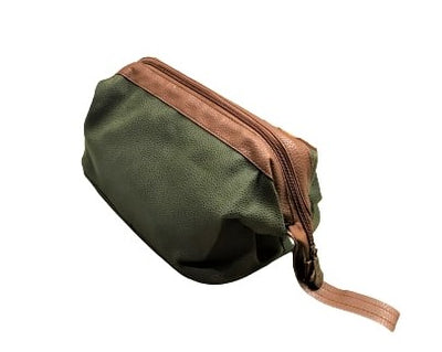 Bellemonde Millwood Green Faux Suede Dopp Kit shown from the side with an engraved zipper pull and light brown loop handle
