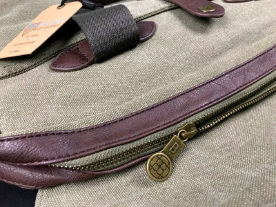 Close-up of washed green canvas Briefcase texture and hardware
